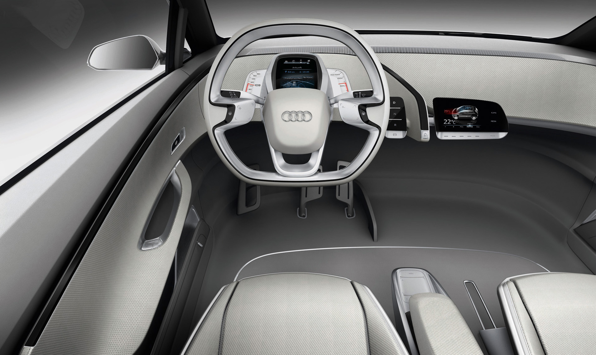 
Vue du poste de conduite de l'Audi A2 Concept, rellement innovant. L'absence d'organes mcaniques dans l'habitacle a permis une ramnagement complet de l'habitacle, avec un style minimaliste.
 