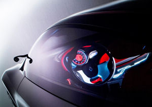 L'clairage des compteurs en rouge et bleu, avec ces touches sur le volant crent une ambiance trs futuriste  bord de ce concept-car Renault Mgane Coup Concept.